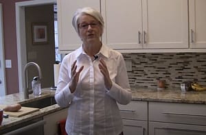 Cynthia Allen demonstrating 15 Exercises to Save Your Back Standing in the Kitchen